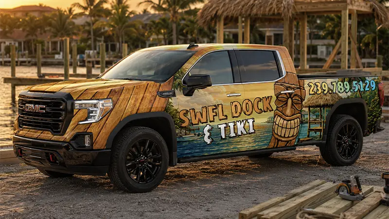SWFL DOCK & TIKI IMAGE 2 MOBILE SWFL Dock & Tiki GMC truck wrap design with wood, water, tiki, and marina-themed graphics