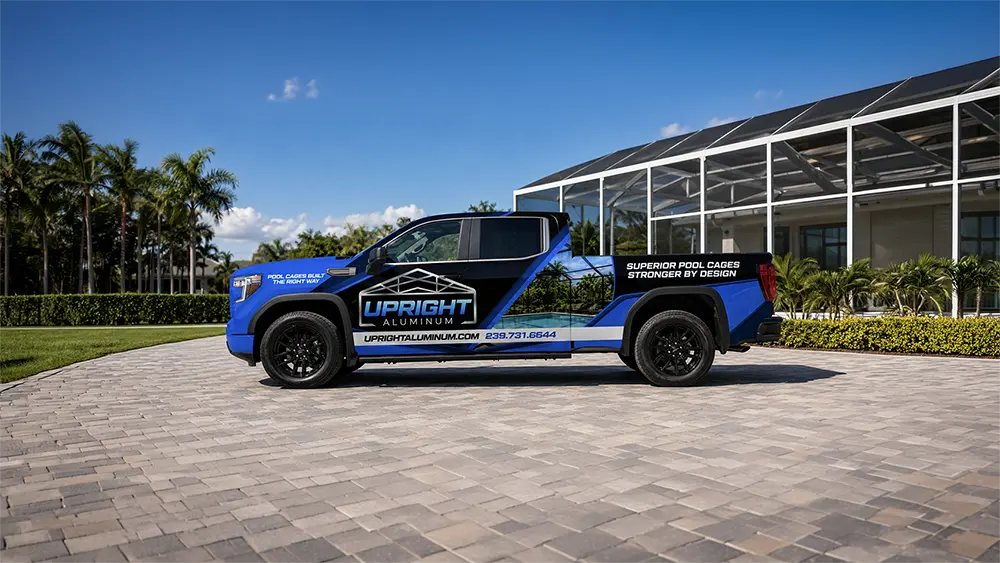 Upright Aluminum Mockup 1 MOBILE_v1 Blue custom wrapped pickup truck for Upright Aluminum showcasing professional vehicle wrap design by Vectorio Graphics in a modern residential driveway in Cape Coral, Florida